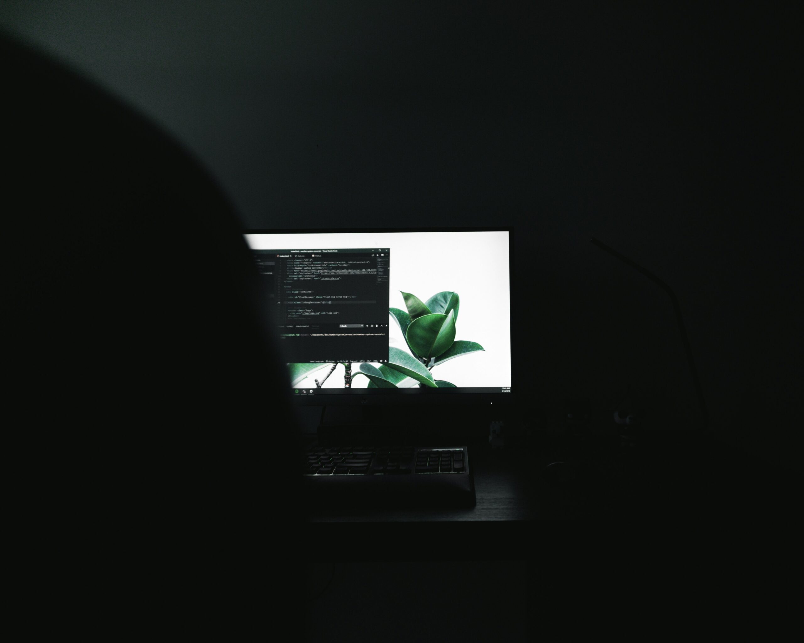 Over he shoulder view of programming on pc